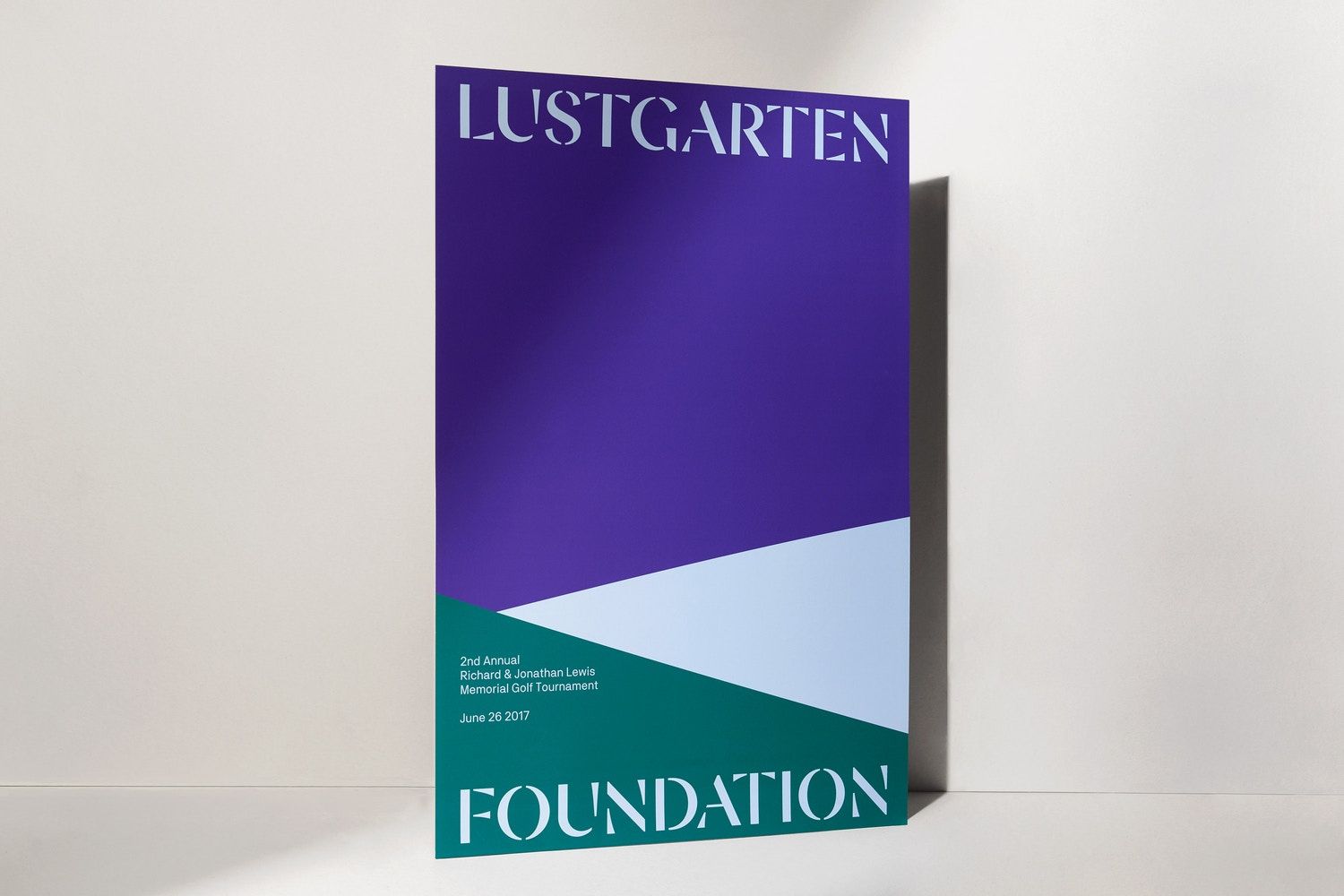 This design utilizes a sophisticated color blocking technique to create a modern and structured visual identity for the foundation. The strong geometric divisions lend an air of stability and elegance to the overall composition.