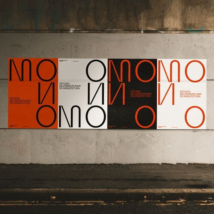 A bold, modular typographic poster series featuring geometric letterforms in a striking red-orange and black color scheme against neutral backgrounds. The design employs repetitive, abstract typography to create a cohesive visual system with strong graphic impact and contemporary minimalist aesthetics.