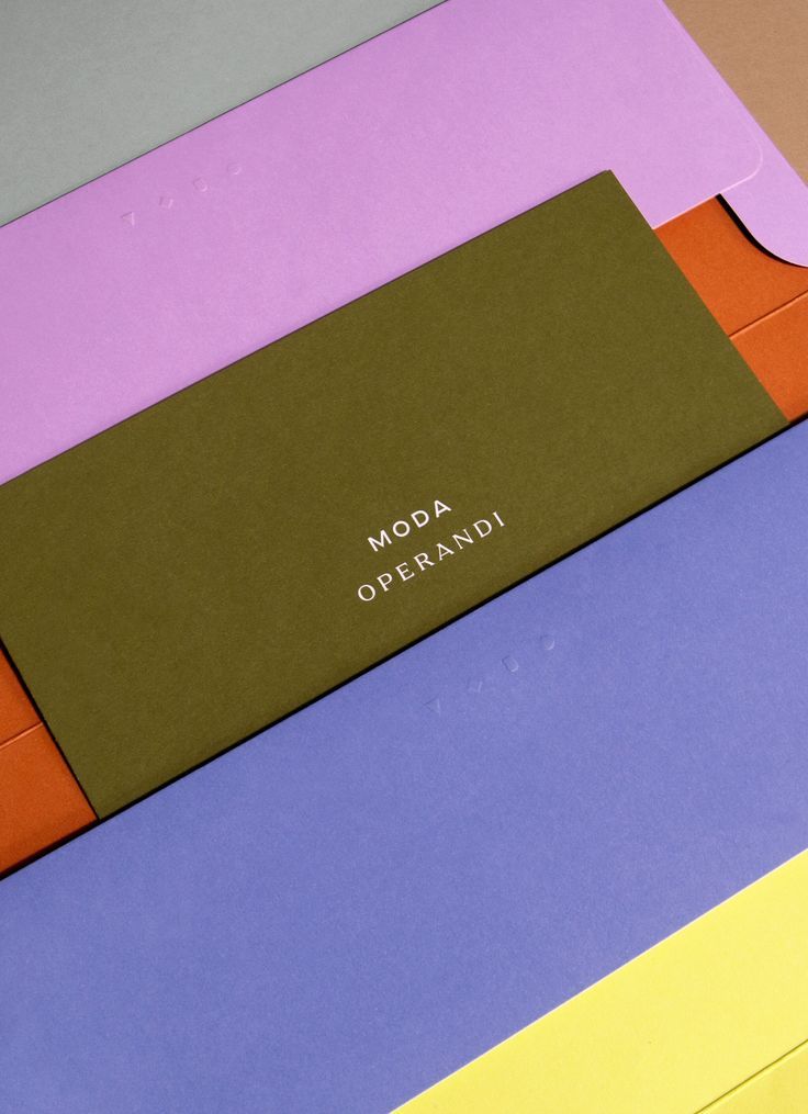 This image showcases a sophisticated, minimalist design utilizing a muted and earthy color palette with sharp geometric layering. The composition is clean and modern, emphasizing texture and the interplay between solid blocks of color.