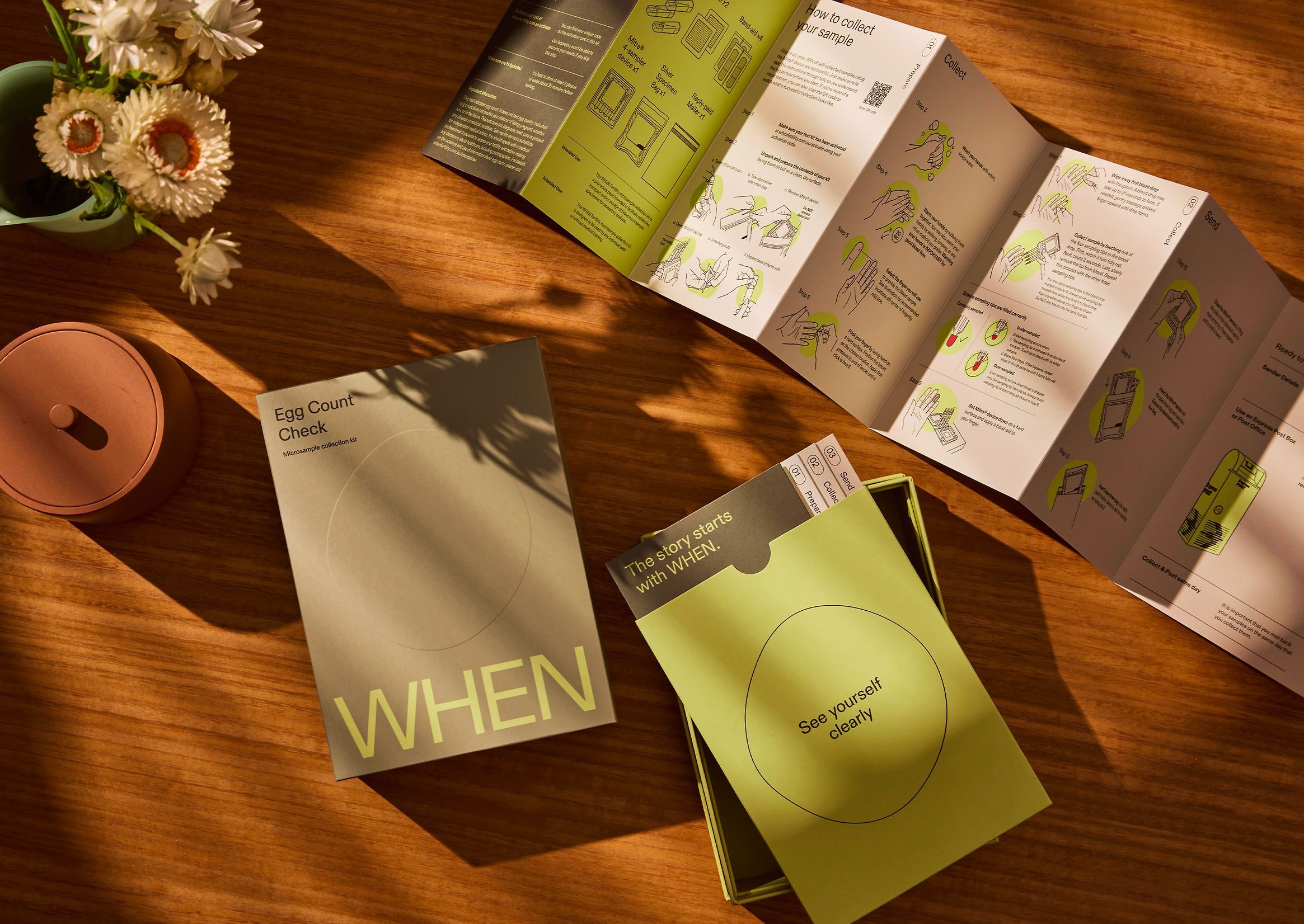 The image showcases a tactile, natural aesthetic centered around informational booklets or guides laid out on a warm wooden surface. The design emphasizes clean, minimalist layouts with a muted, earthy color palette, suggesting a focus on organic or artisanal products.
