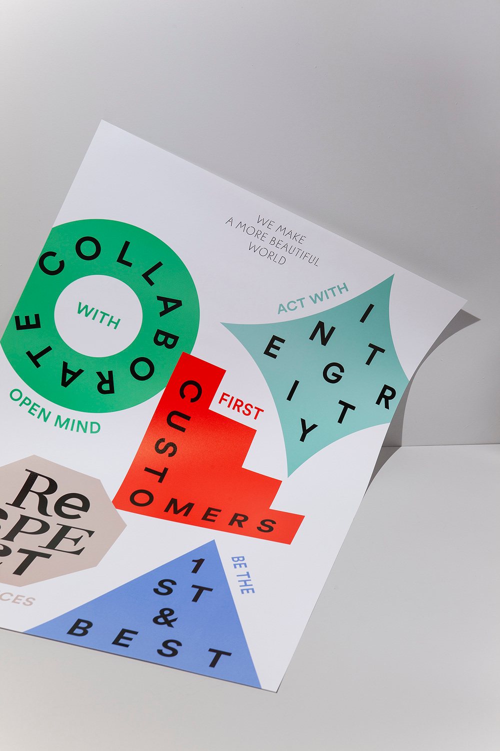 This design utilizes bold geometric shapes and vibrant color blocking to convey themes of collaboration, respect, and quality. The visual language is modern and clean, employing overlapping forms to create dynamic depth and emphasis on key concepts.