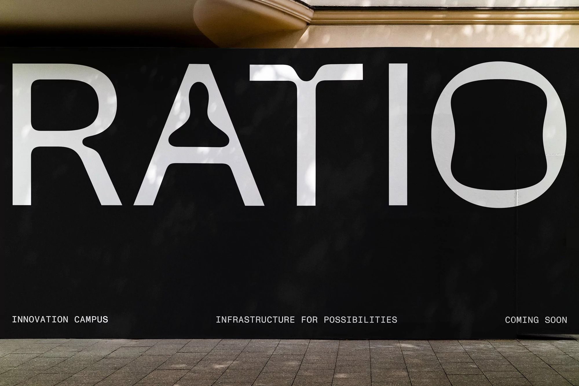 The image features bold, stark white sans-serif typography set against a dark, matte background, conveying a sense of modern professionalism and gravitas. The design relies heavily on negative space and strong contrast to create a clean, impactful statement.