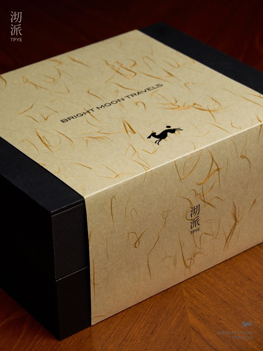 This is a minimalist and sophisticated product presentation, likely for a luxury item or collectible. The design relies on a muted, natural kraft paper texture contrasted with stark black elements, creating an elegant and earthy aesthetic.