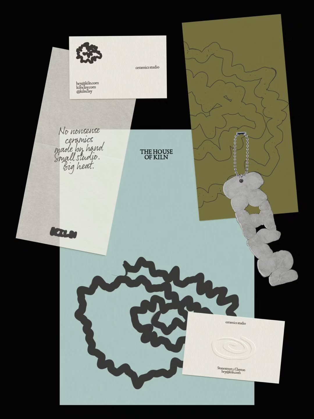 This is a minimalist and sophisticated design composition featuring muted earth tones and soft pastels, utilizing negative space effectively to create a sense of quiet elegance. The layout is structured yet open, allowing each element—cards and the pendant—to stand as a distinct object.