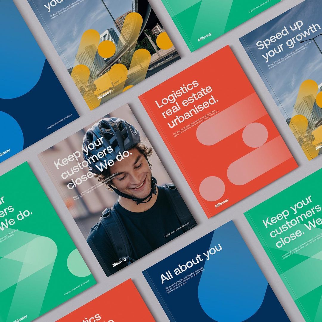 A modern corporate branding system featuring a vibrant, geometric color-blocked design with bold sans-serif typography and abstract circular shapes. The layout showcases multiple branded collateral pieces arranged in an overlapping, dynamic composition that emphasizes contemporary business aesthetics and professional communication.