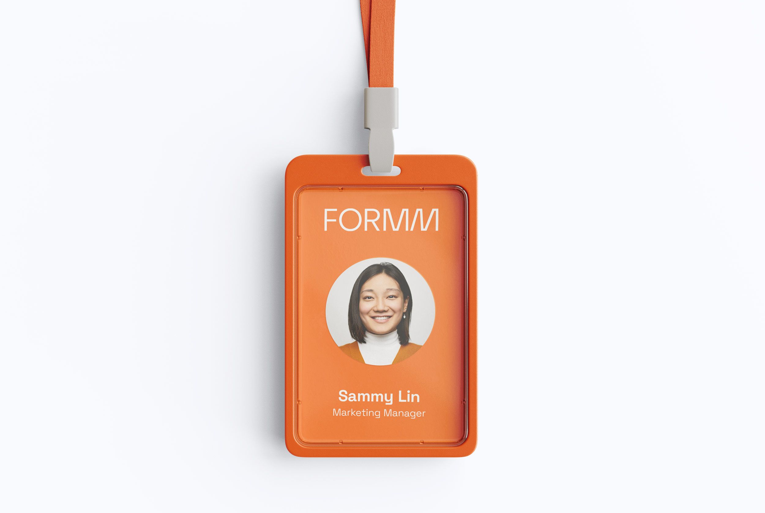 This image displays a professional identification badge or credential, characterized by a clean, modern design using warm orange tones. The layout is straightforward, featuring a circular portrait against a solid background, conveying a sense of official recognition and approachability.