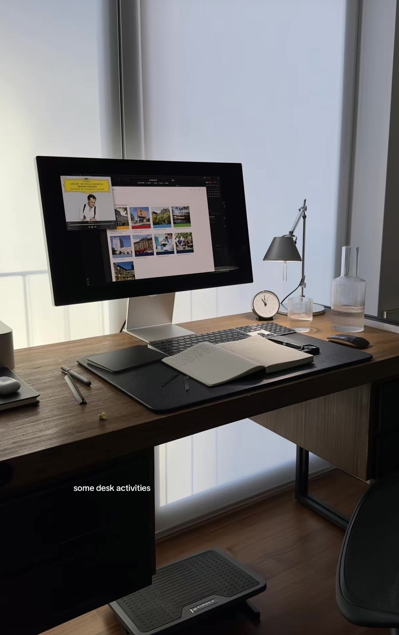 This image presents a highly organized and contemporary workspace characterized by clean lines and warm natural materials. The visual language emphasizes functionality, modern technology integration, and a sophisticated, calm atmosphere.