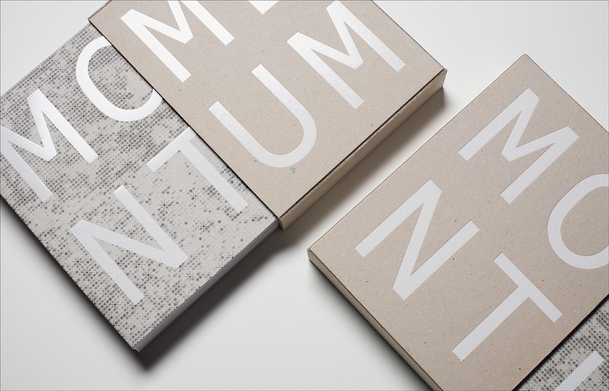 The image features a close-up arrangement of three rectangular boxes or cards, likely packaging or stationery, characterized by a minimalist and sophisticated aesthetic. The design relies heavily on negative space and a muted, earthy color palette to convey a sense of clean, modern elegance.