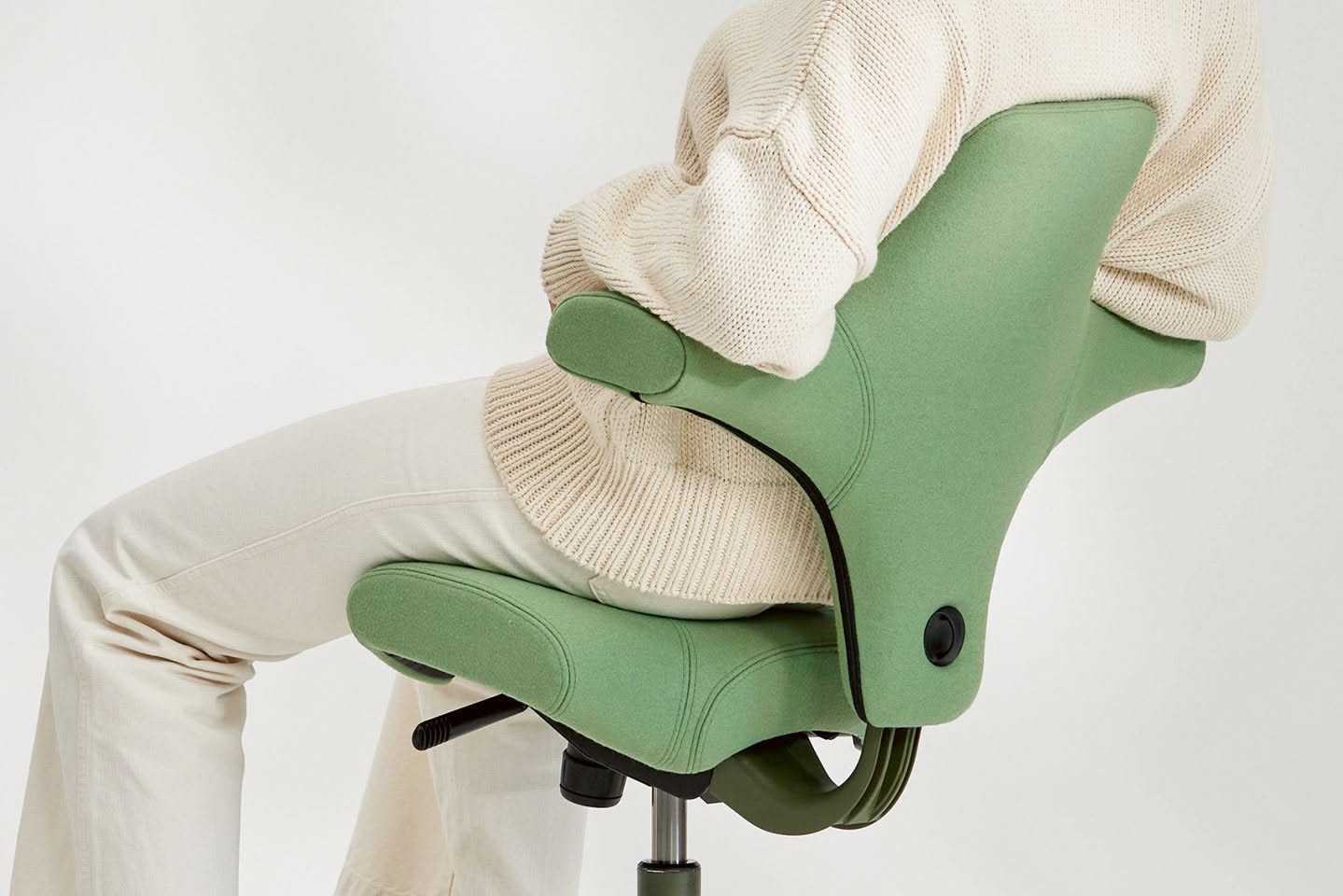 Modern office chair product design with sleek metal frame and ergonomic seating. Professional product photography with studio lighting highlighting form and materials. Contemporary furniture design suitable for commercial and residential spaces.