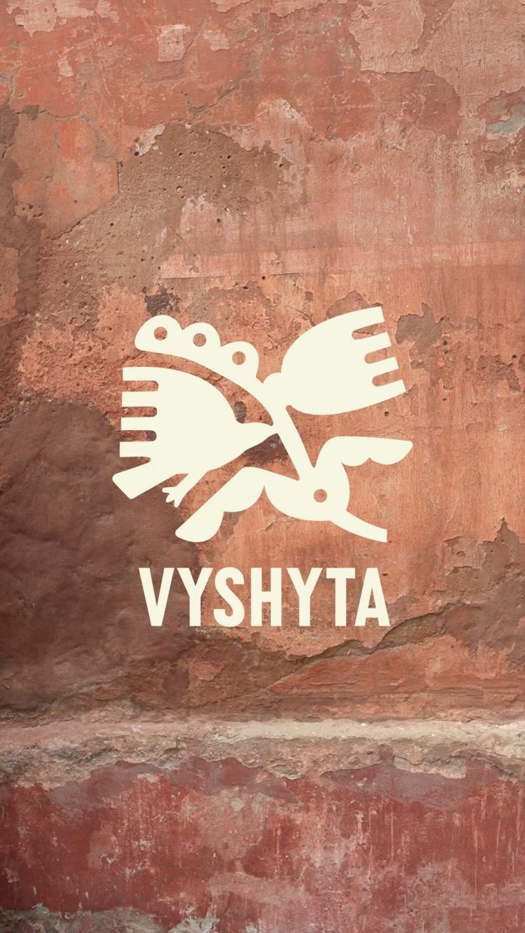 The image features a stark, monochromatic graphic mark set against a textured, earthy background. The design employs clean lines and negative space to create a minimalist yet symbolic visual identity.