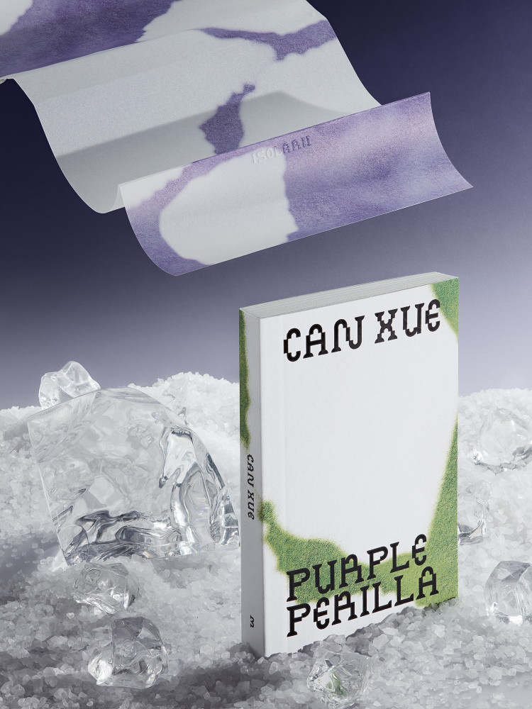 This image presents a minimalist and ethereal design featuring soft purple watercolor elements layered over a stark white background, juxtaposed with a physical book object resting on a bed of ice. The visual language is delicate and translucent, suggesting themes of fragility and artistic expression.