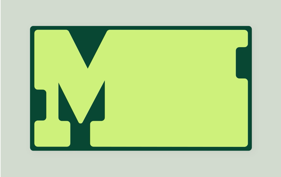 This is a clean, minimalist logotype featuring a large, blocky capital letter 'M' rendered in a muted, light green color. The design relies on strong geometric shapes and negative space to create a solid, modern, and corporate feel.