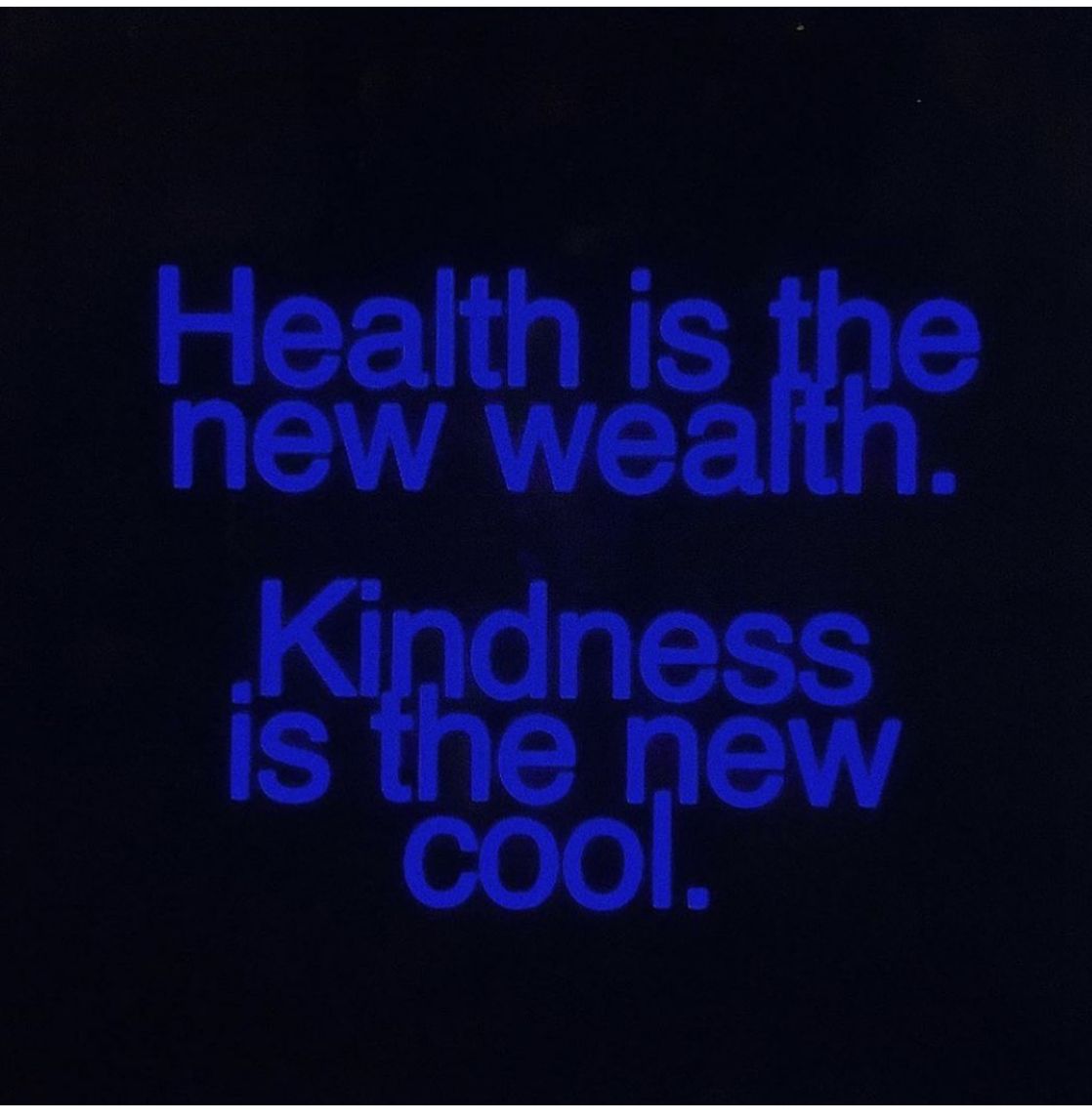 This is a high-contrast, minimalist typographic design that uses stark black and bright blue to convey a simple yet profound message. The visual language relies entirely on the juxtaposition of text and negative space to create an immediate, impactful statement.