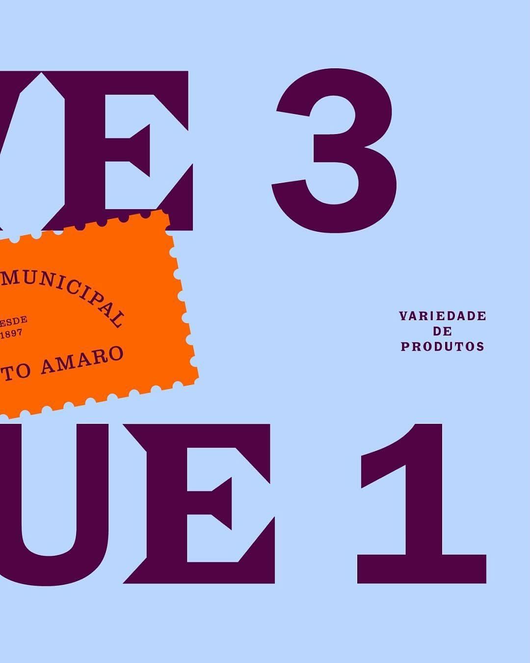 A bold, contemporary design featuring large geometric typography in deep plum against a soft periwinkle background. An orange stamp-like element with Portuguese text adds a playful, authentic accent that contrasts with the minimalist layout. The composition balances geometric abstraction with functional information hierarchy.