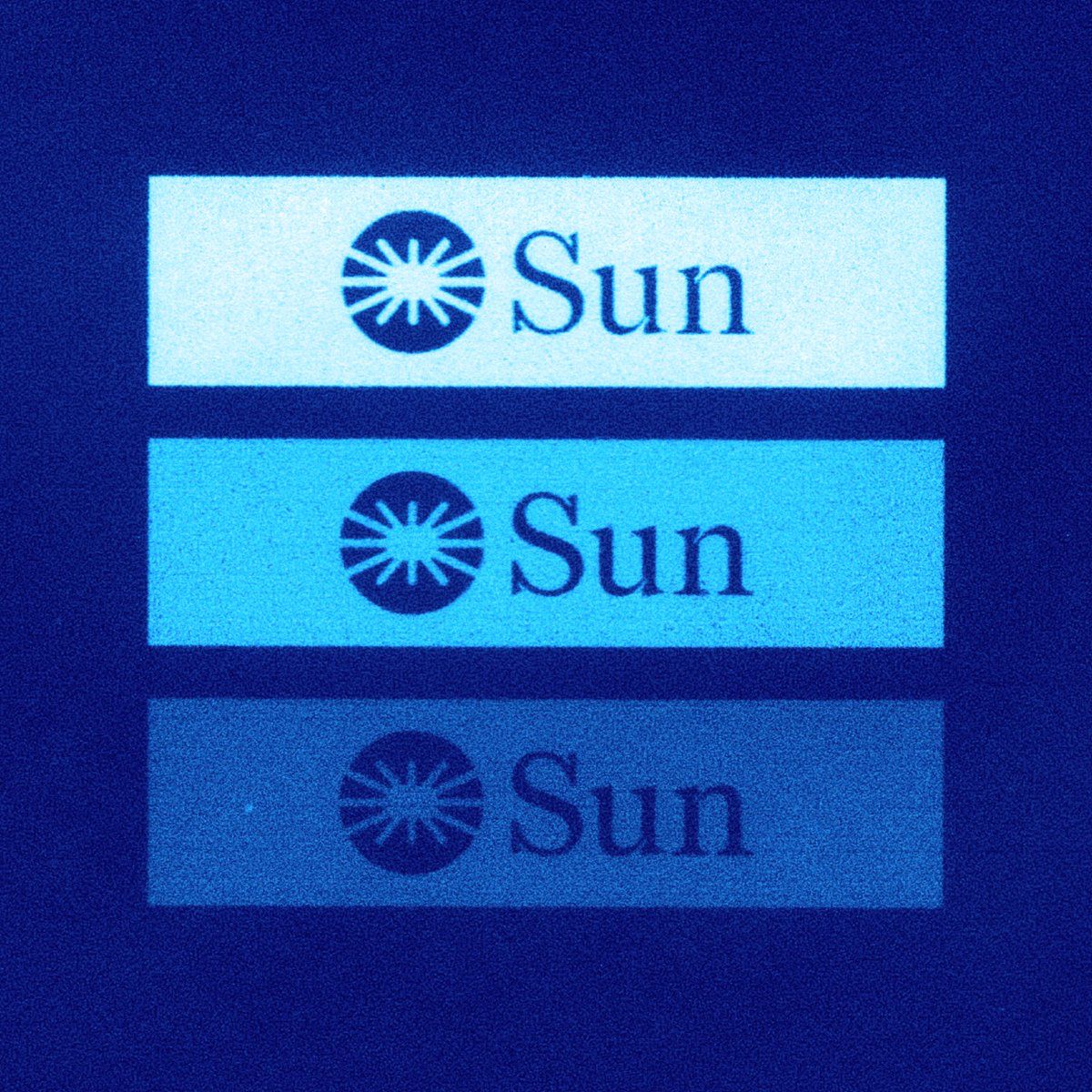 The image presents a minimalist, high-contrast design featuring three stacked rectangular elements with a light blue background and dark text/icons. The visual language is clean, functional, and relies on simple iconography to convey a singular concept repeatedly.