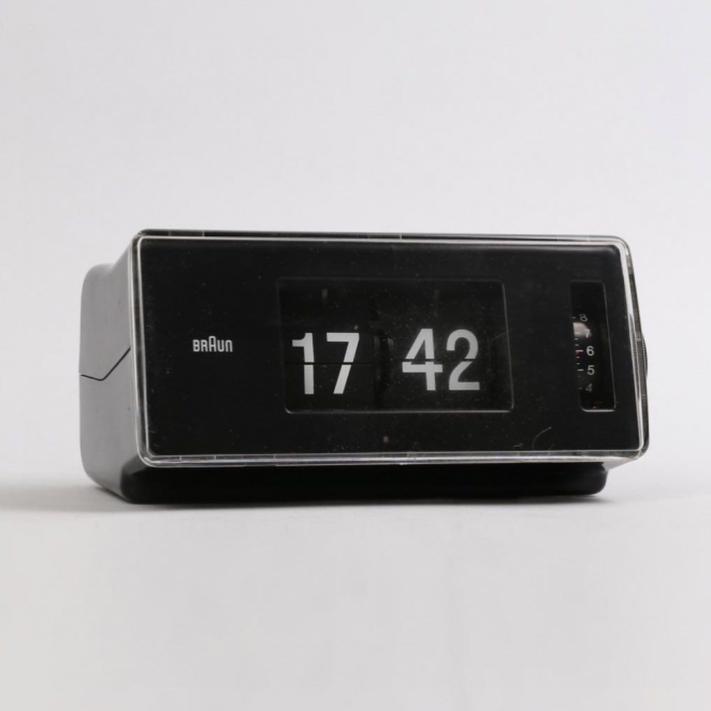 This is a minimalist, utilitarian electronic device featuring a clear digital display against a matte black casing. The design emphasizes function and readability through high contrast, resulting in a clean, modern, and robust aesthetic.