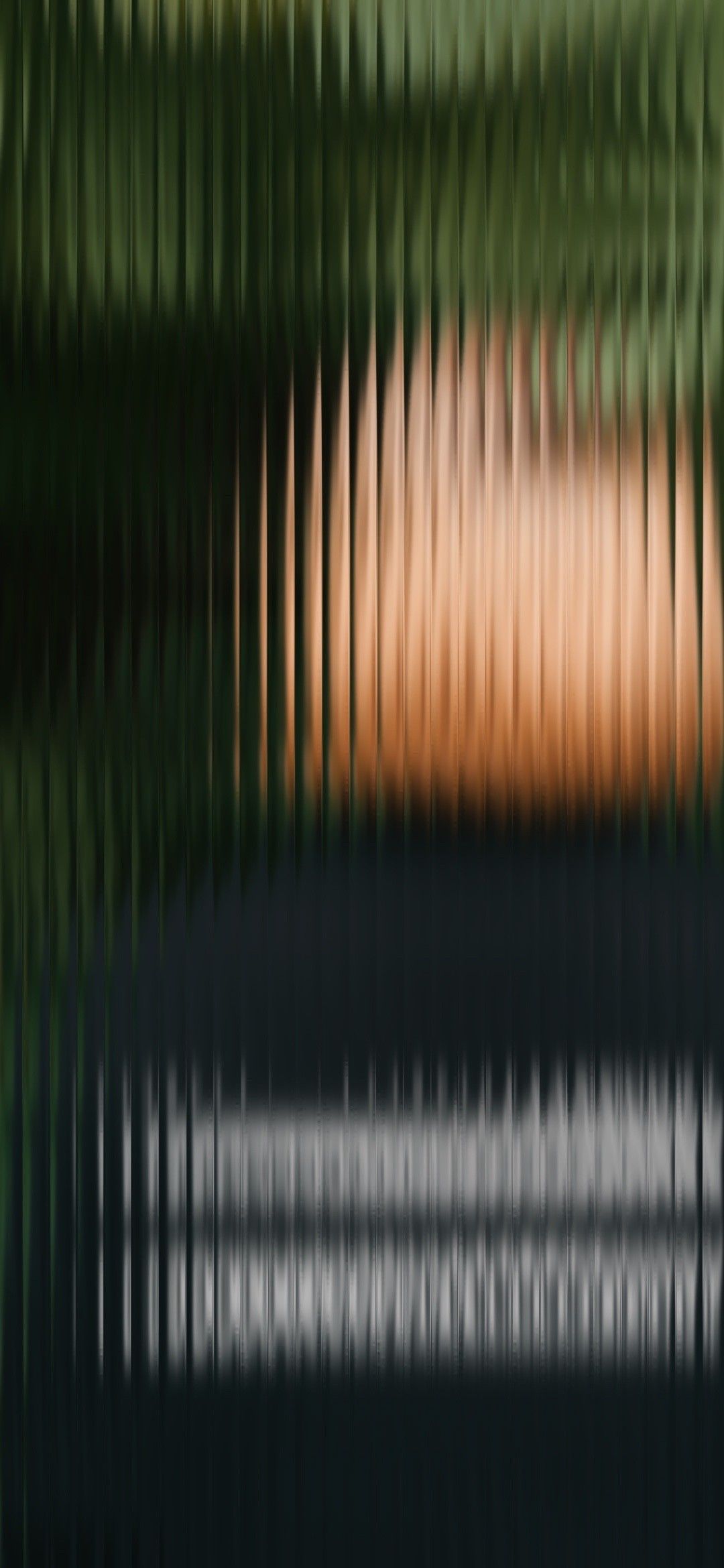 This image is an abstract composition defined by strong vertical lines and a smooth color gradient transitioning between cool greens and warm oranges. The design evokes a sense of depth, rhythm, and subtle warmth through its linear interplay.