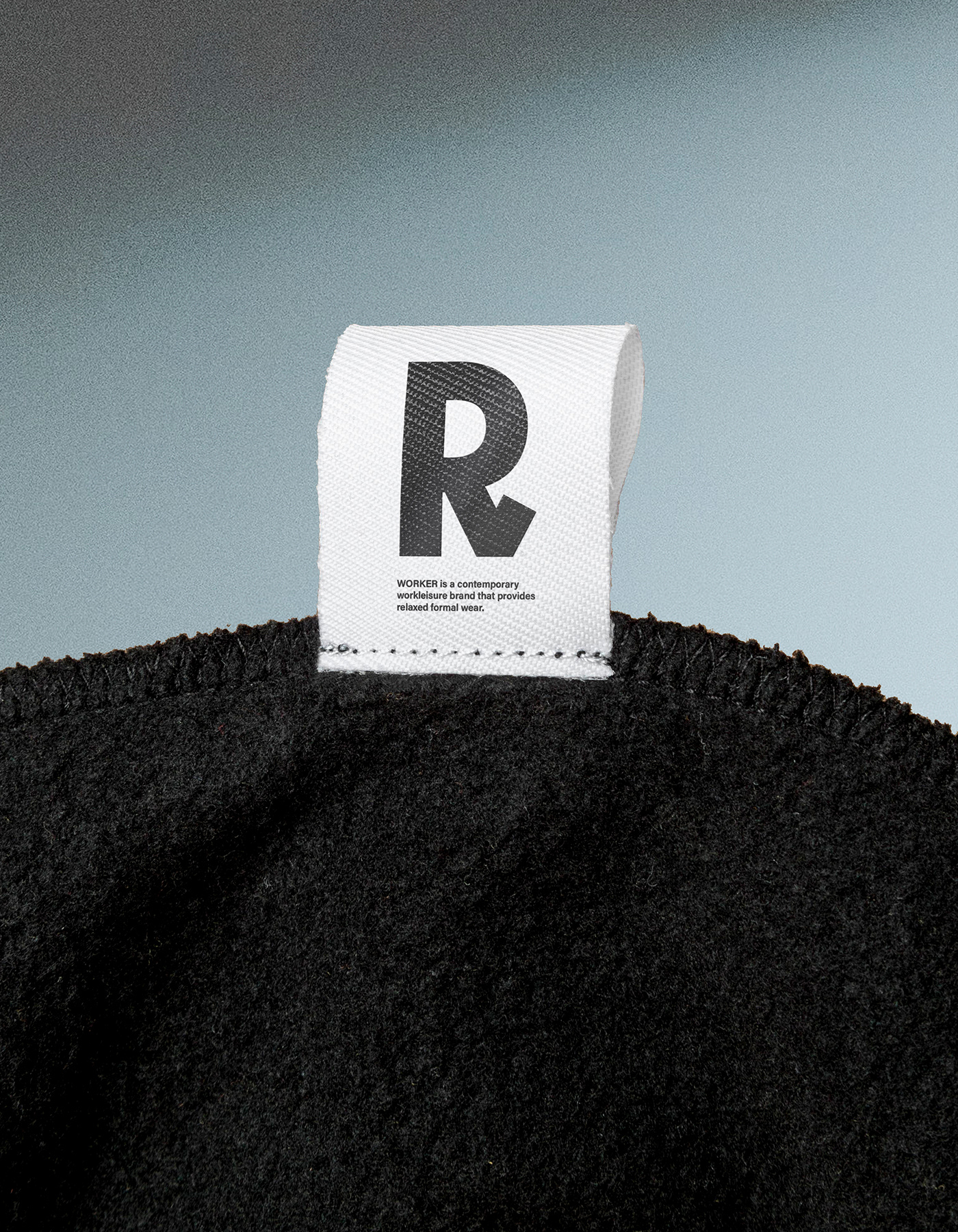 This design utilizes stark minimalism, focusing on the powerful contrast between clean typography and raw, dark texture. The visual language is quiet and sophisticated, relying heavily on negative space and monochrome elements to convey a sense of modern refinement.