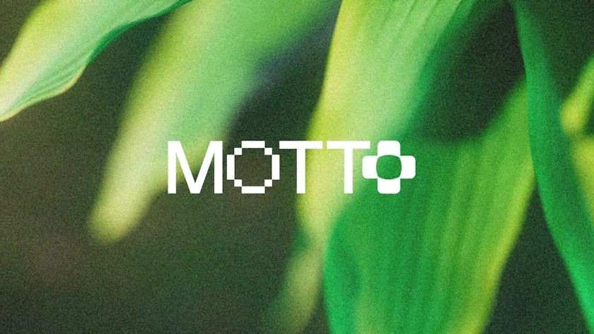 A modern, minimalist design featuring the word 'MOTTO' in a geometric, pixelated typeface overlaid on a soft-focus organic background of green leaves and natural foliage. The composition blends digital precision with natural imagery, creating a contemporary aesthetic that bridges technology and nature.