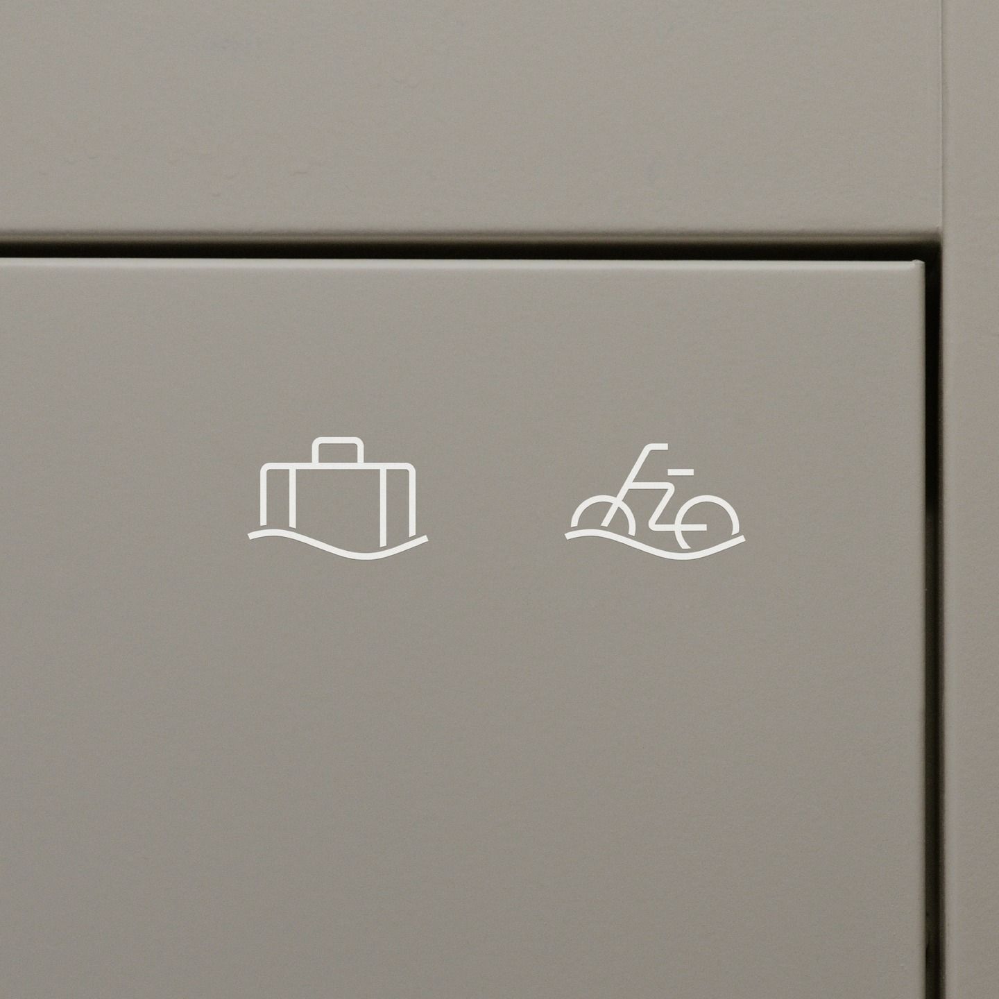 This image showcases a minimalist approach to functional design, utilizing simple line icons on a muted surface. The visual language is clean and intentional, focusing purely on conveying information through universally recognized symbols.