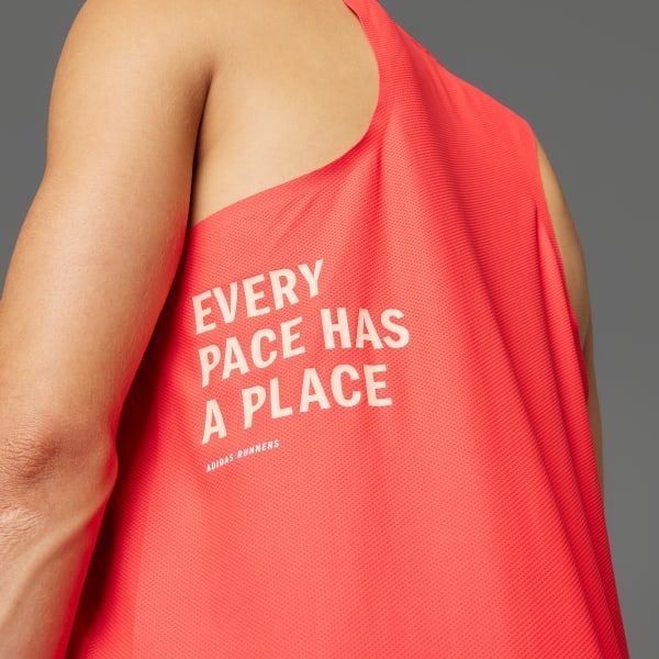 This design utilizes a clean, minimalist approach pairing bold typography with a vibrant coral hue to create an encouraging and motivational message. The visual language is straightforward, leveraging negative space effectively to highlight the core phrase and brand attribution.