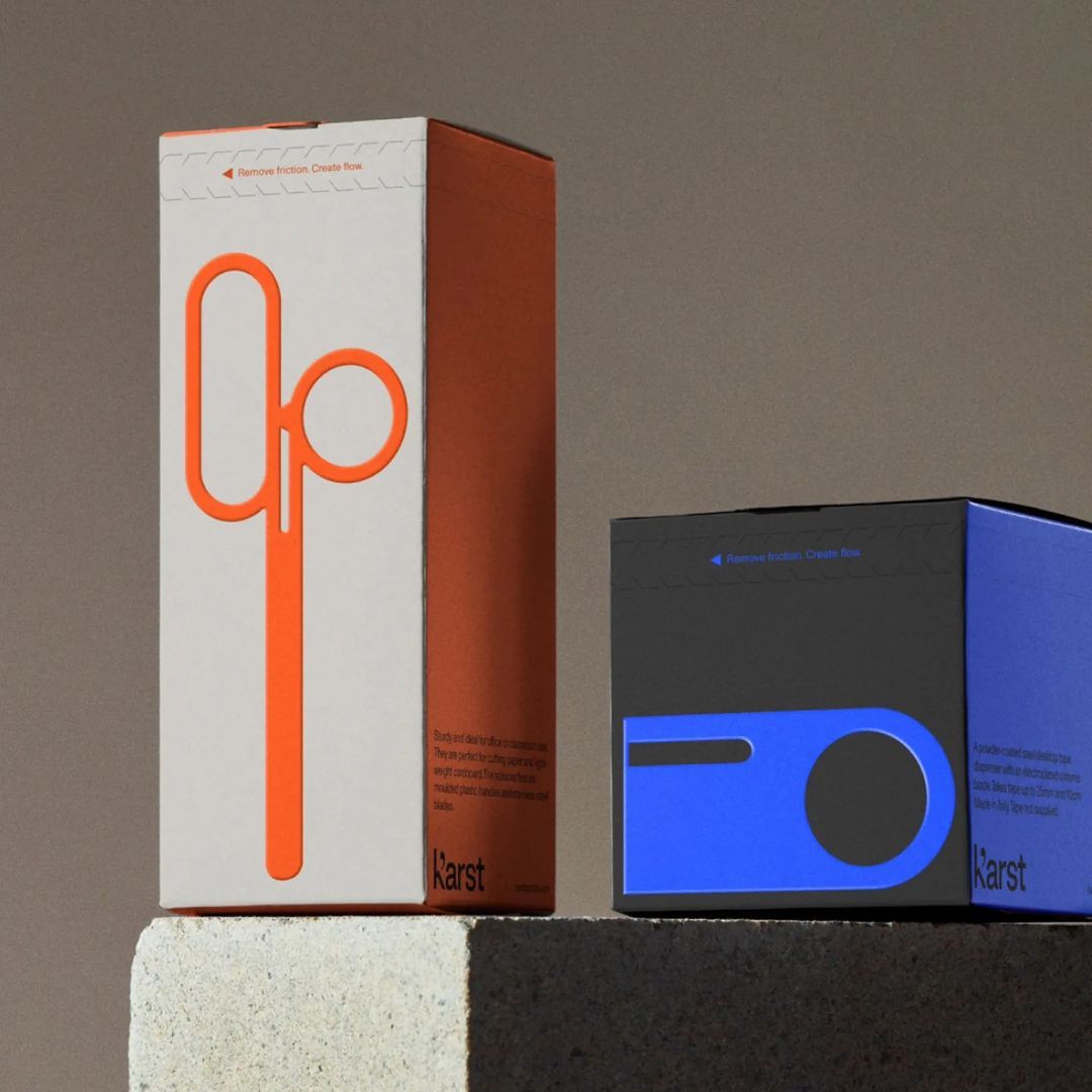 The image presents a minimalist and modern product packaging design, characterized by clean lines and a strong focus on the brand mark. The use of a single vibrant orange against a neutral background creates a striking yet sophisticated visual identity.
