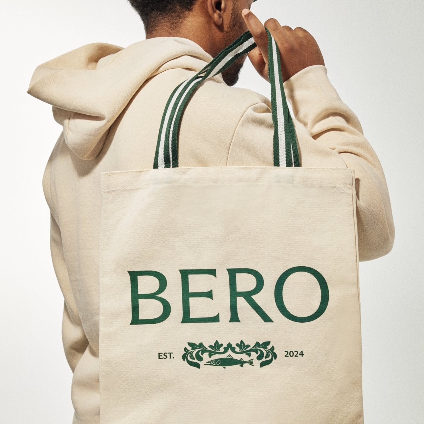 This image showcases a clean, minimalist aesthetic centered around natural tones and organic textures. The visual language emphasizes simplicity and earthiness through muted colors, soft fabrics, and simple yet elegant branding elements.