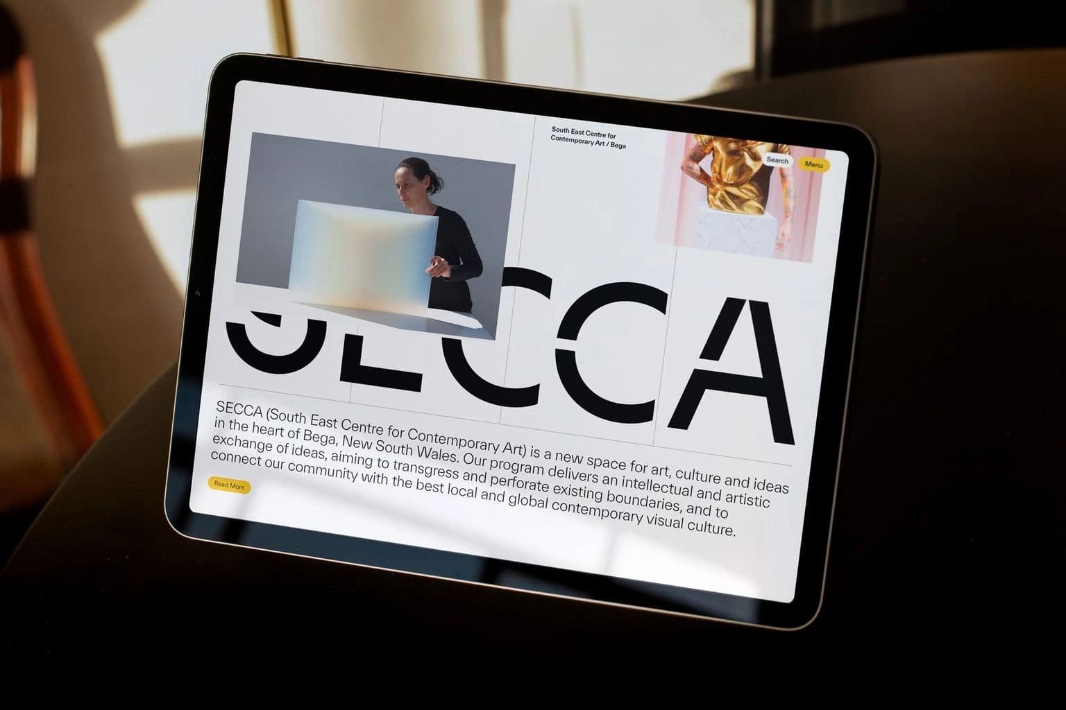 The design utilizes a stark, high-contrast layout combining clean typography with subtle photographic elements to establish a professional and contemporary identity. The visual language is minimalist, relying heavily on negative space to create clear hierarchy between the logo and explanatory text.