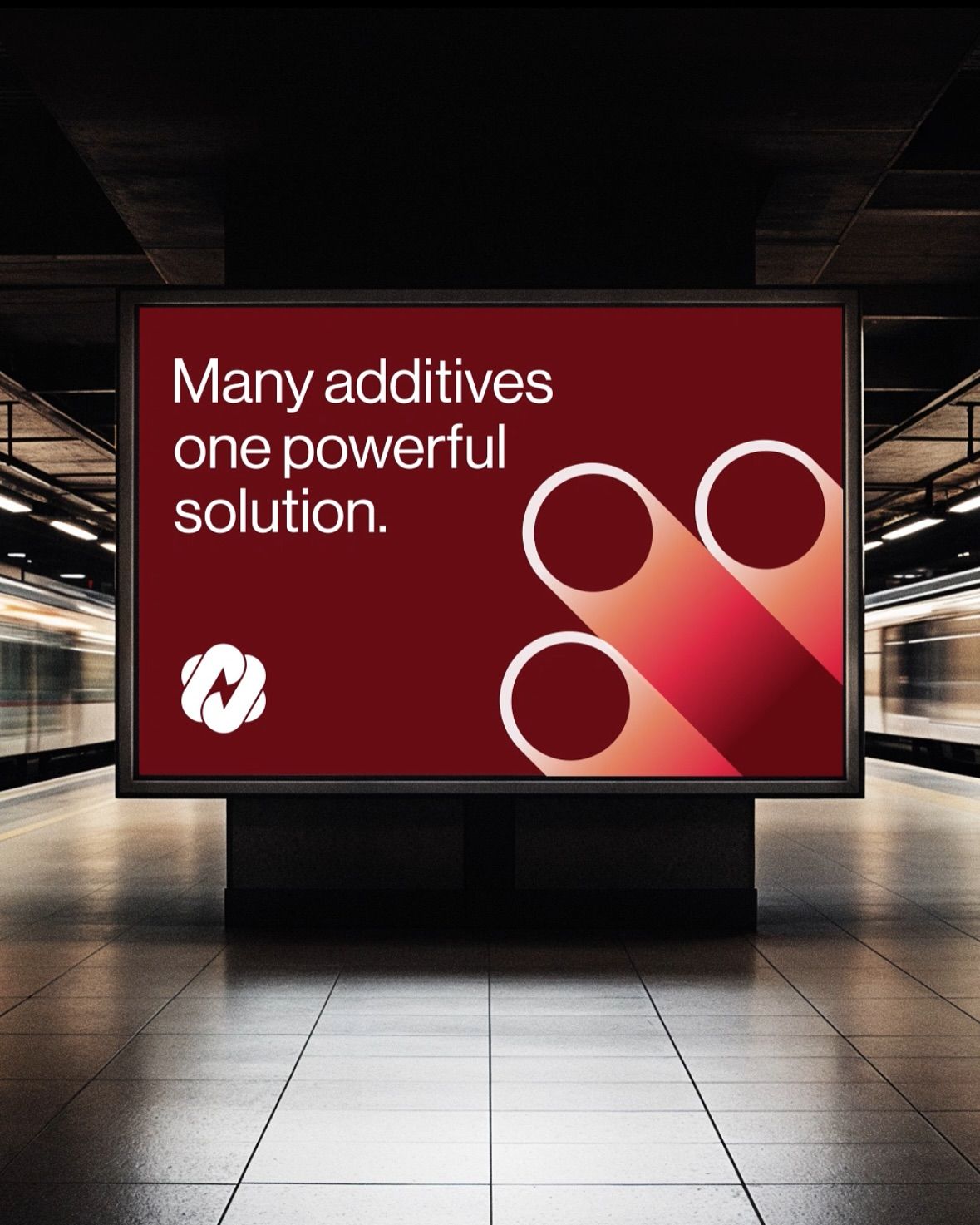 The image features a large, backlit display with bold, white text against a deep red background, set within a modern, somewhat industrial or transit-like environment. The composition is clean and focused, emphasizing the message through high contrast and simple geometric shapes.