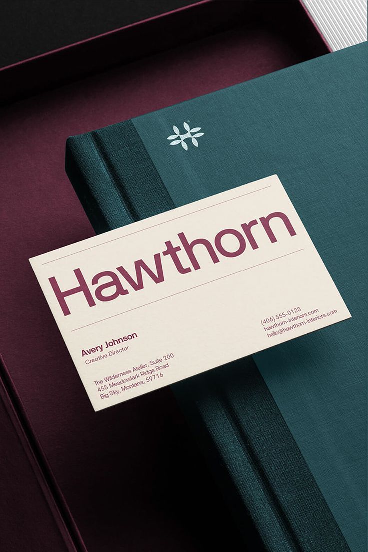 A sophisticated brand identity system featuring a minimalist business card and teal folder with refined geometric accents. The design employs a restrained color palette and clean typography to convey professionalism and contemporary elegance. The composition demonstrates careful attention to material texture and spatial hierarchy.