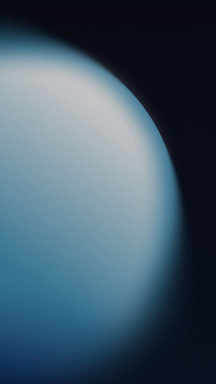 This image features a smooth, gradient sphere against a dark background, utilizing soft light and shadow to create a sense of depth and celestial mystery. The visual language is minimalist and atmospheric, relying heavily on subtle tonal shifts to define form.