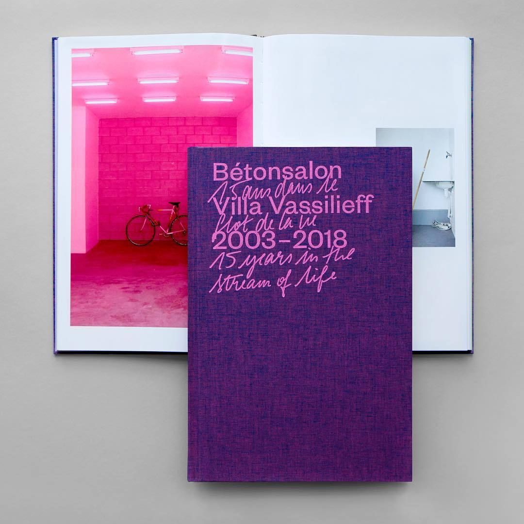 This image presents a striking juxtaposition between vibrant, saturated interior photography and a deep, matte purple cover. The design balances bold color and clean typography to convey a sense of personal achievement or memory.