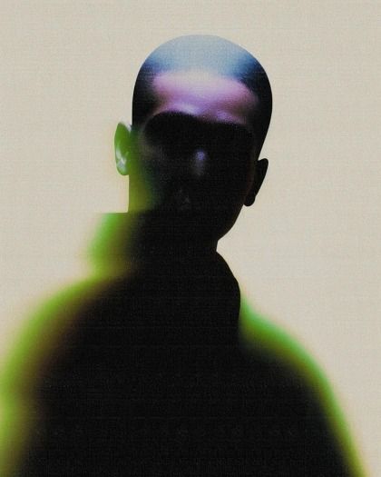 This is a highly stylized, high-contrast portrait characterized by deep shadows and vibrant, diffused color gradients. The visual language relies on atmospheric lighting and abstract color blending to create a mysterious and immersive feeling.