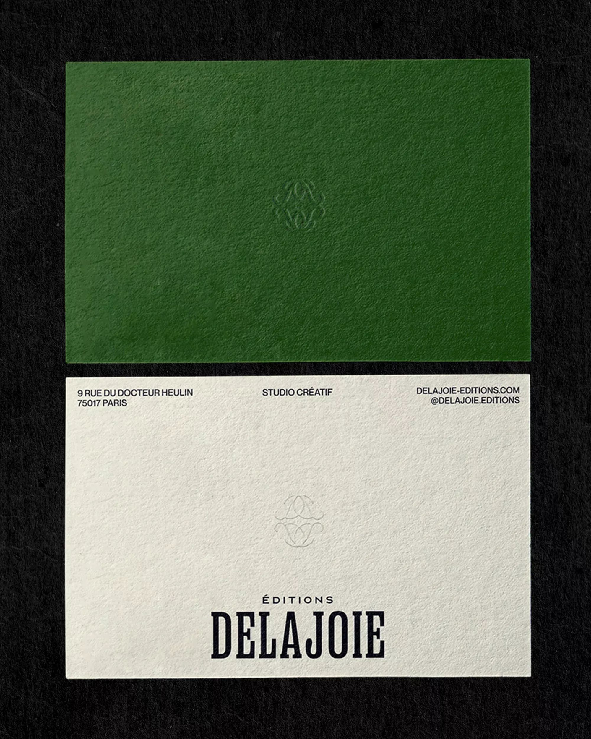 This is a minimalist and sophisticated design featuring a stark contrast between deep olive green and off-white paper stock. The layout is clean, utilizing negative space effectively to emphasize the brand name and subtle graphic elements.