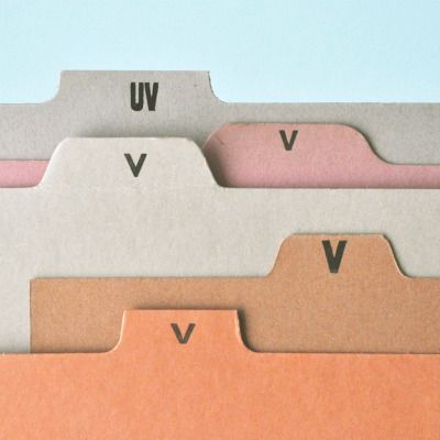 This image displays a set of layered, card-like elements, likely for packaging or printing, characterized by muted, earthy tones and clean, minimalist typography. The design emphasizes texture through the paper stock while maintaining a sophisticated, natural aesthetic.