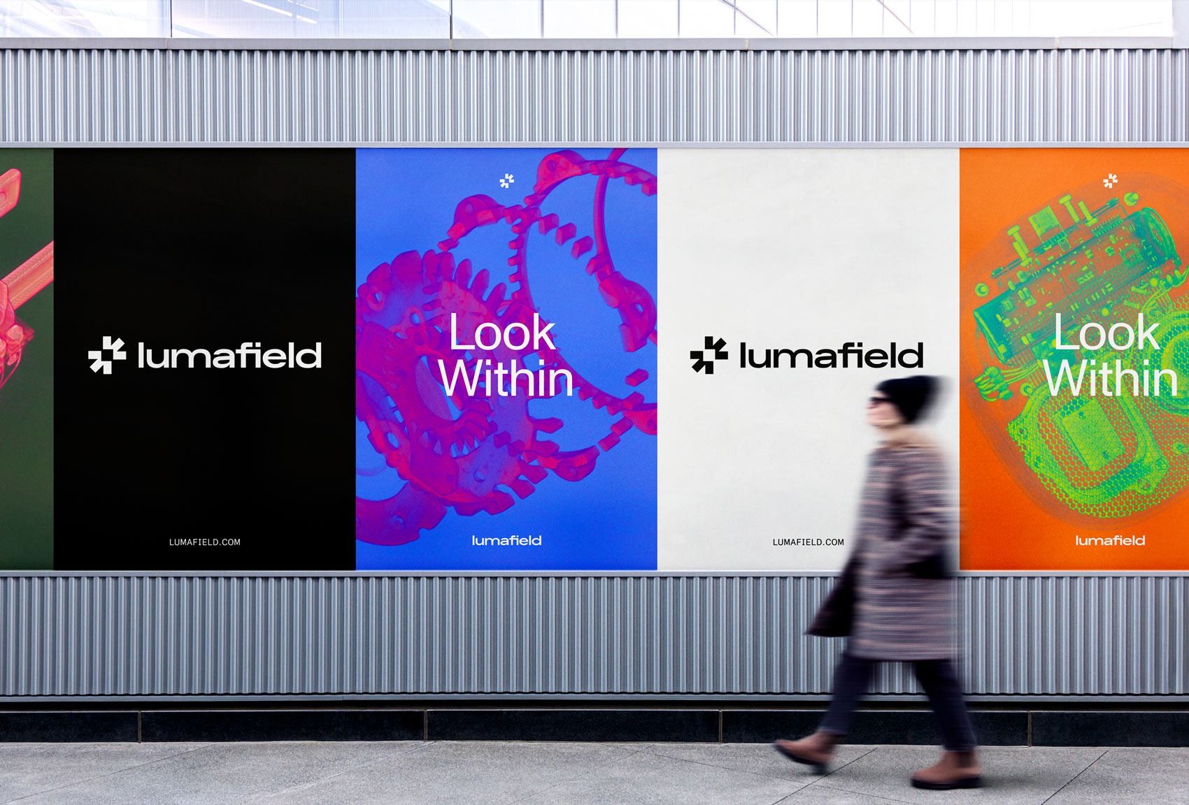 The image displays a modern, clean architectural or exhibition wall featuring large, distinct panels with vibrant graphic elements and minimalist branding. The design balances bold color accents against a neutral background, creating a sophisticated and contemporary visual experience.