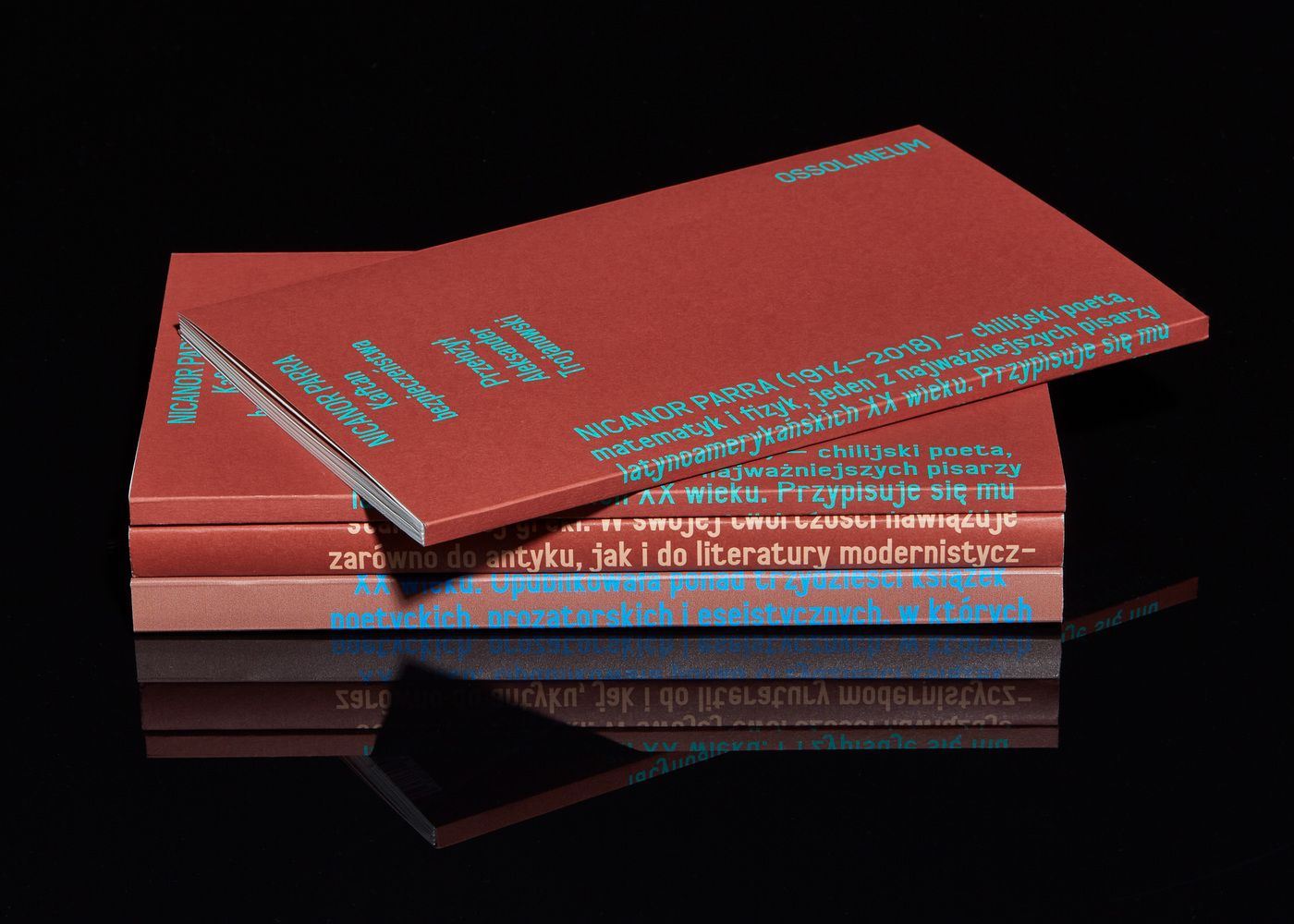 The image presents a minimalist and sophisticated study of stacked, uniformly colored paper or cardstock, suggesting an archival or literary theme. The design relies heavily on texture and subtle text placement to convey a sense of academic seriousness and refined simplicity.