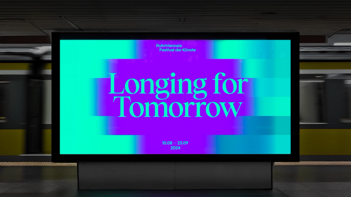 The image features a large, brightly lit digital screen displaying vibrant, cool-toned gradients and bold white text against a dark background. The design is modern, clean, and uses strong color blocking to create a sense of forward-looking optimism.