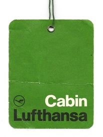 This is a simple, utilitarian identification tag featuring a solid, muted green background with clear white typography. The design relies on high contrast and minimalist elements to convey official branding in a straightforward manner.
