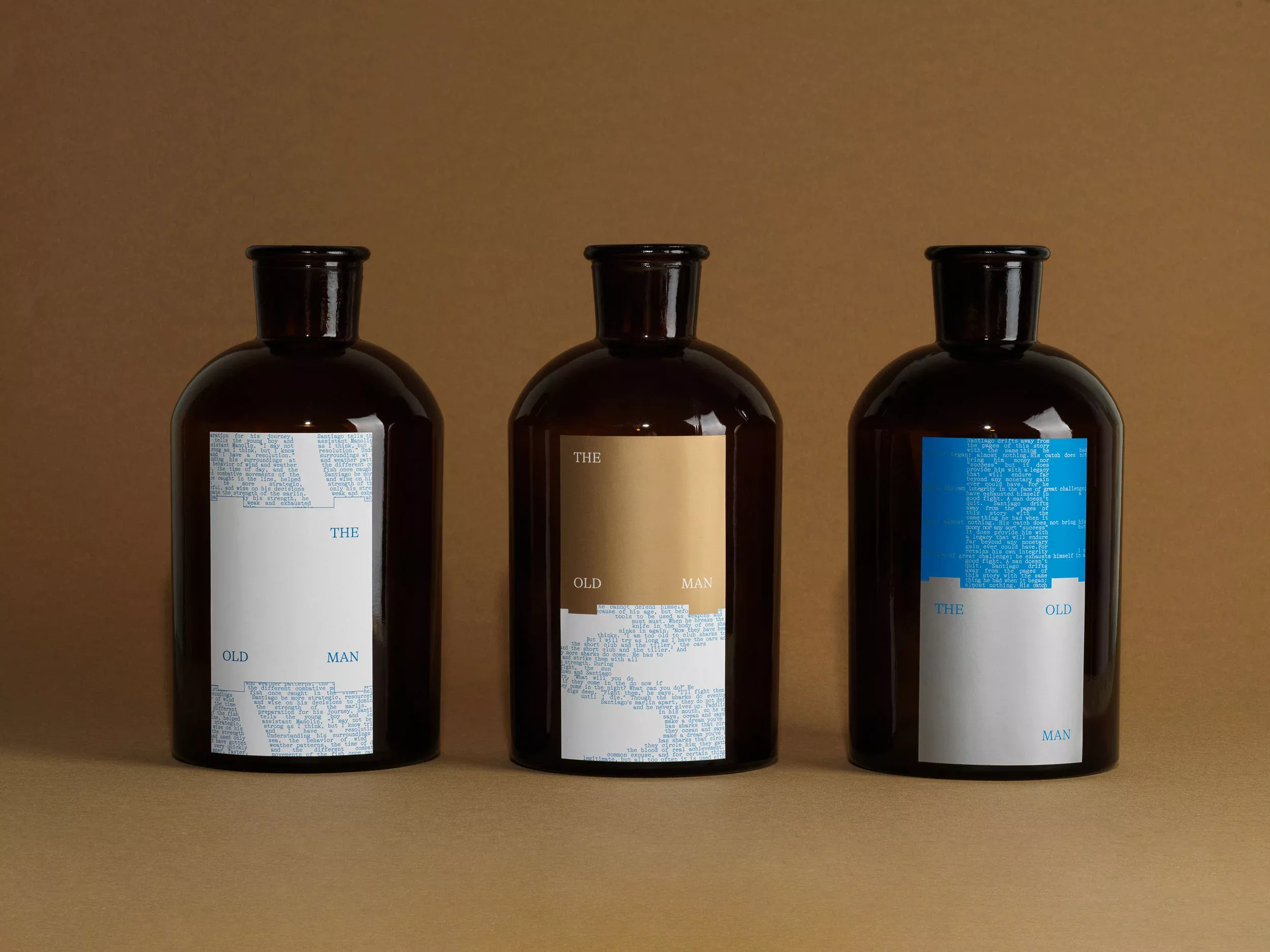 This image presents a minimalist and sophisticated product display featuring three dark glass bottles, likely for premium spirits or oils. The design relies heavily on negative space and a restrained color palette to convey a sense of luxury and classic elegance.