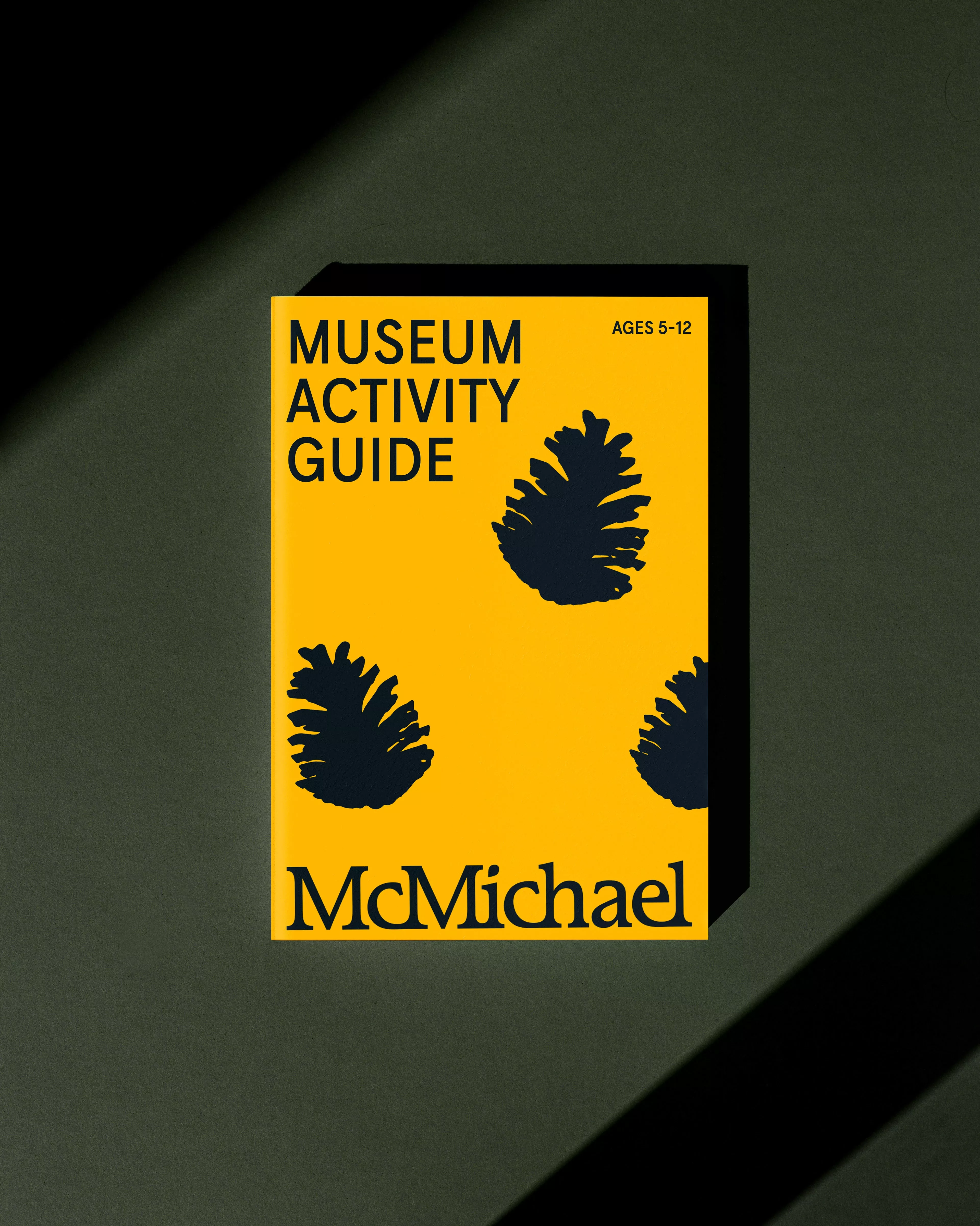 This design utilizes high contrast between a muted, earthy background and a vibrant yellow focal point to create an inviting yet structured look. The use of simple, dark silhouettes adds a natural, tactile element to the educational theme.