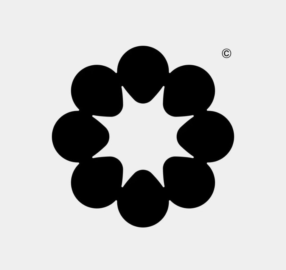 This design features a clean, minimalist graphic composed of a ring of solid black circular elements against a neutral background. The visual language relies heavily on high contrast and simple geometric repetition to create a balanced, focused emblem.