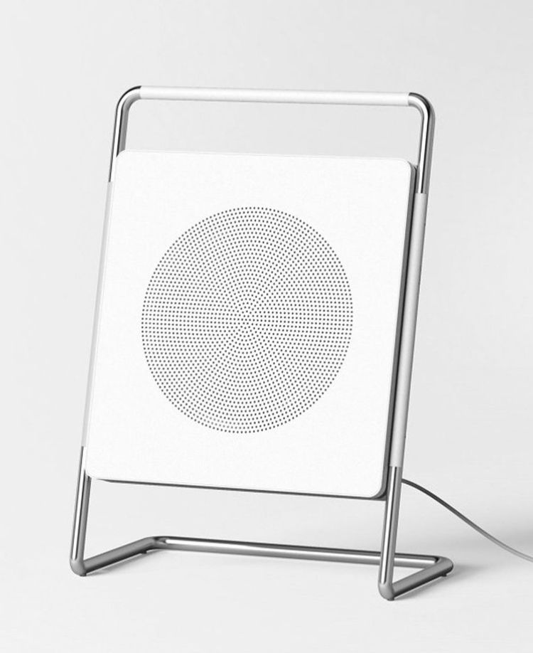 This image presents a minimalist, modern design object, likely a piece of technical or artistic hardware, characterized by clean lines and a stark white surface. The focus is on the texture of the circular pattern against the smooth background, conveying precision and contemporary aesthetics.
