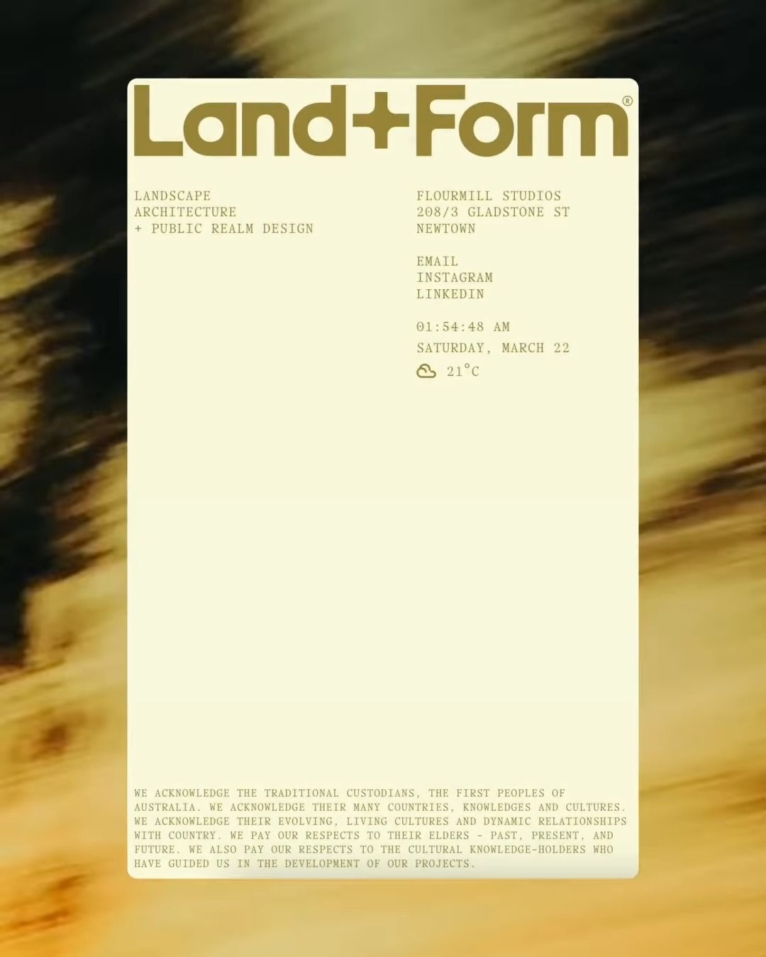 The design is minimalist and sophisticated, utilizing a muted, earthy color palette and clean typography to convey a sense of established professionalism. The layout is sparse, emphasizing white space and clear hierarchy for contact information.