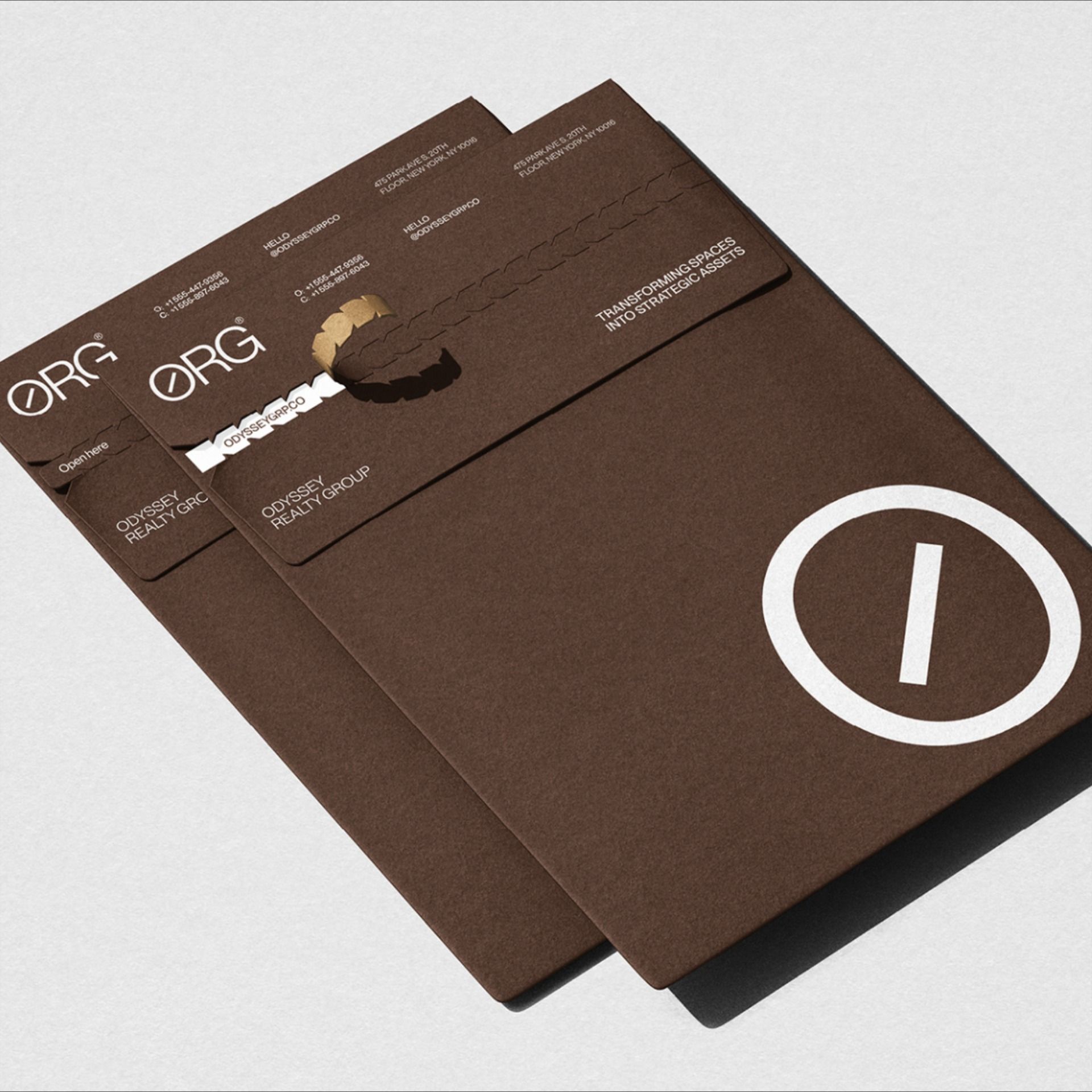 A sophisticated brand identity system featuring layered brown cardstock materials with minimalist geometric elements. The design employs a restrained color palette and clean typography, creating a premium, contemporary aesthetic that emphasizes elegance through simplicity and material quality.