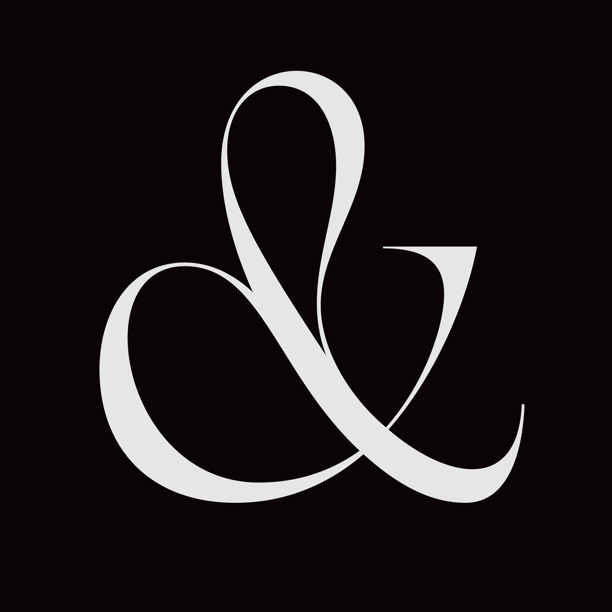 A minimalist ampersand symbol rendered in clean white strokes against a deep black background, creating a striking typographic mark with elegant, flowing curves. The design demonstrates sophisticated letterform construction with balanced negative space and refined line weight throughout.
