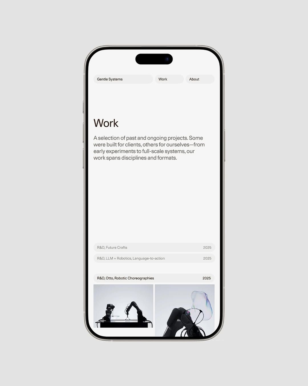 A minimalist portfolio website displayed on a smartphone mockup, featuring clean typography and a sophisticated layout with monochromatic imagery. The design emphasizes negative space and editorial clarity, showcasing a 'Work' section with project listings and atmospheric black-and-white photography.