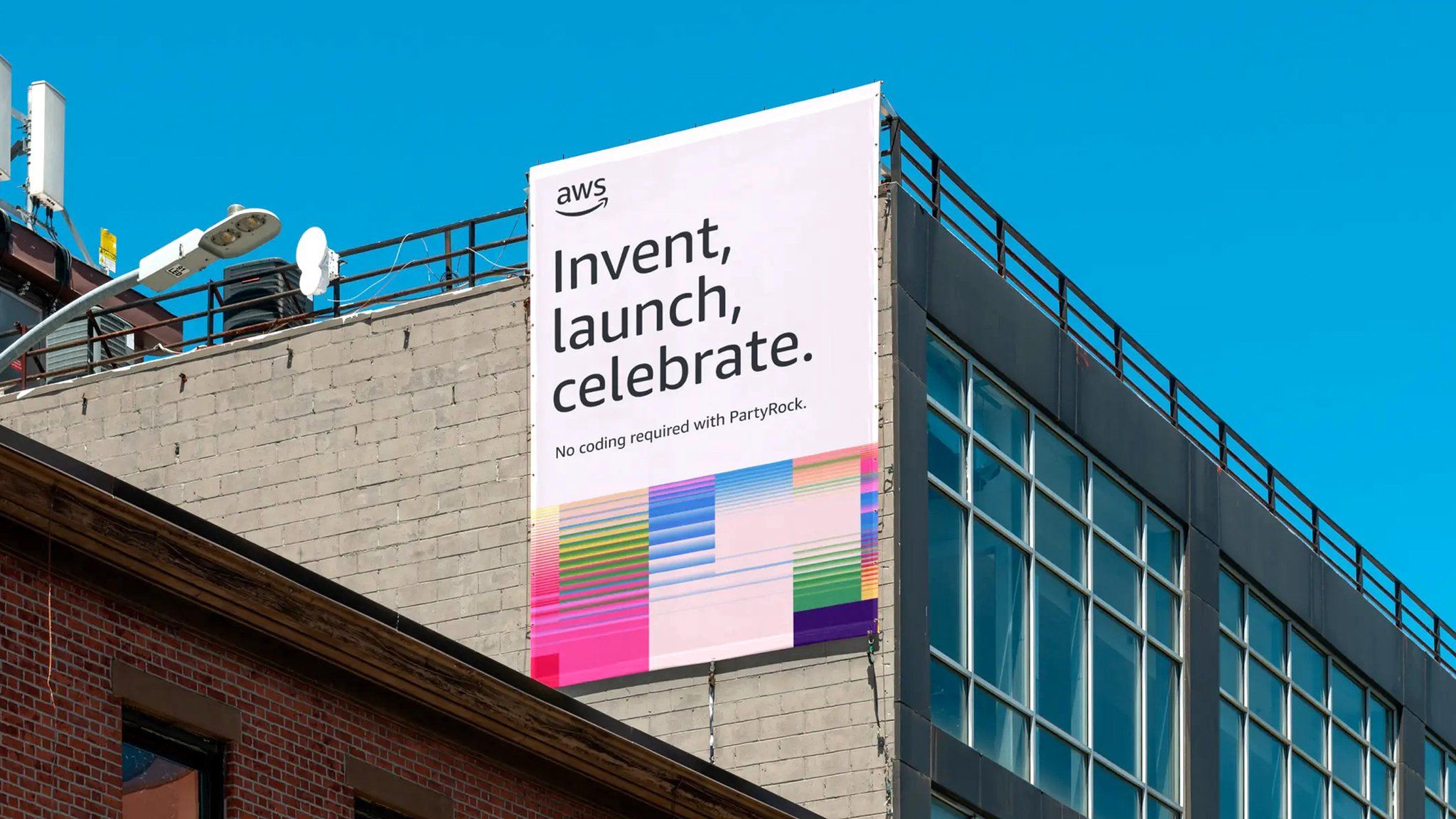 This image showcases a clean, modern corporate visual where clear messaging is presented on a large vertical banner set against an industrial architectural backdrop. The design effectively balances professional branding (AWS) with vibrant, modern graphic accents to convey innovation and ease of use.